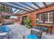 Inviting covered patio with brick accents, outdoor seating, and a pergola offering a cozy space at 6314 N 14Th Pl, Phoenix, AZ 85014