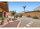 Charming backyard featuring a decorative fountain, rock landscaping, and easy-care desert plants at 6314 N 14Th Pl, Phoenix, AZ 85014