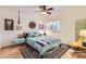 Bedroom featuring a queen bed, shutters, and unique decor that adds character to the space at 6314 N 14Th Pl, Phoenix, AZ 85014