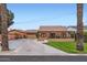 Charming single-story brick home featuring a well-manicured lawn, covered porch and a detached garage at 6314 N 14Th Pl, Phoenix, AZ 85014