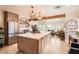 Bright kitchen featuring stainless steel appliances, open shelving, a large island, and pendant lights at 6314 N 14Th Pl, Phoenix, AZ 85014