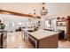 Bright kitchen featuring a large island with stainless steel appliances, and pendant lighting at 6314 N 14Th Pl, Phoenix, AZ 85014