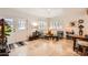 Bright living room with tile floors, neutral walls, and french door access to front porch at 6314 N 14Th Pl, Phoenix, AZ 85014