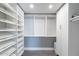 Walk-in closet with built-in shelving and hanging rods offering maximum storage and organization at 6502 N Central Ave # A103, Phoenix, AZ 85012