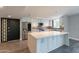 Contemporary kitchen with an island, stainless steel appliances, and stylish backsplash at 6502 N Central Ave # A103, Phoenix, AZ 85012