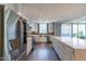 Modern kitchen featuring stainless steel appliances, sleek white cabinetry, and a large central island at 6502 N Central Ave # A103, Phoenix, AZ 85012