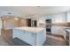 Beautiful kitchen with stainless steel appliances, stylish cabinets and an island at 6502 N Central Ave # A103, Phoenix, AZ 85012