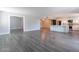 Open-concept living and kitchen area with hardwood flooring, creating a seamless and stylish space at 6502 N Central Ave # A103, Phoenix, AZ 85012