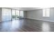 Bright and airy living room with large windows and hardwood floors at 6502 N Central Ave # A103, Phoenix, AZ 85012
