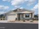 Charming single-story home with a two-car garage and a well-maintained, drought-resistant front yard at 7694 W Saddlehorn Rd, Peoria, AZ 85383