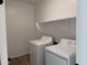 Functional laundry room with shelving and appliances for efficient laundry tasks, and tile floor at 7694 W Saddlehorn Rd, Peoria, AZ 85383