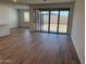Bright living space with tile flooring, and sliding glass doors leading to outdoor space at 7694 W Saddlehorn Rd, Peoria, AZ 85383