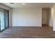 Open-concept living room with tiled floors, offering a versatile space for relaxation and entertaining at 7694 W Saddlehorn Rd, Peoria, AZ 85383