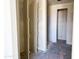 A bathroom featuring an open doorway with double doors and standing shower ready to customize at 7701 W Avenida Del Rey --, Peoria, AZ 85383