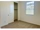 Bedroom showcasing a closet, plush neutral carpet, and a window for natural lighting at 7701 W Avenida Del Rey --, Peoria, AZ 85383