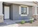 Close up of front door with white shutters and front porch landscaping at 7701 W Avenida Del Rey --, Peoria, AZ 85383