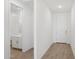 Bright hallway leading to a bathroom and front door at 7701 W Avenida Del Rey --, Peoria, AZ 85383