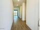 Hallway featuring wood-look tile flooring and leading to a glass sliding door at 7701 W Avenida Del Rey --, Peoria, AZ 85383