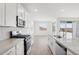 Bright kitchen featuring quartz countertops, stainless appliances, and tile flooring at 7701 W Avenida Del Rey --, Peoria, AZ 85383