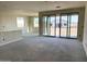 Bright living room boasts large windows and sliding glass doors, creating a light filled and welcoming atmosphere at 7701 W Avenida Del Rey --, Peoria, AZ 85383