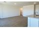 Spacious living room with wood-look tile flooring and open layout at 7701 W Avenida Del Rey --, Peoria, AZ 85383