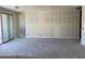 Expansive living room with sliding glass doors offering natural light and seamless indoor-outdoor living space at 7701 W Avenida Del Rey --, Peoria, AZ 85383