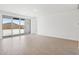 Living room featuring tile floors and sliding glass doors to a patio at 7701 W Avenida Del Rey --, Peoria, AZ 85383
