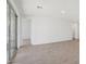 Open living room featuring tiled floor and sliding glass doors to a patio at 7701 W Avenida Del Rey --, Peoria, AZ 85383