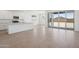 Living space with kitchen and living area with tile floor and sliding glass door at 7701 W Avenida Del Rey --, Peoria, AZ 85383