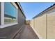 Side yard of the house with a walkway and block wall at 7701 W Avenida Del Rey --, Peoria, AZ 85383