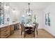 Cozy dining area with a modern chandelier and large windows with plantation shutters at 7787 E Via Casta --, Scottsdale, AZ 85258