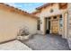 View of the front door entrance with pavers and a water fountain on a sunny day at 7915 E Stonecliff Cir, Mesa, AZ 85207