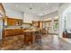 Open kitchen with island and breakfast nook showcasing custom cabinetry and granite countertops at 7915 E Stonecliff Cir, Mesa, AZ 85207