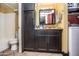 Bathroom with granite countertops, dark cabinetry, tile flooring, and built in storage at 8155 E Roosevelt St # 231, Scottsdale, AZ 85257
