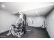 Community gym featuring full-body weight machine, bench press, and rubber flooring at 8155 E Roosevelt St # 231, Scottsdale, AZ 85257