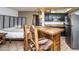 A compact kitchen with stainless steel appliances, granite countertops, and bar seating at 8155 E Roosevelt St # 231, Scottsdale, AZ 85257