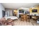 An open floor plan view of a living space with a bedroom, kitchen, and bar seating area at 8155 E Roosevelt St # 231, Scottsdale, AZ 85257