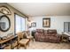 Inviting living room featuring tile floors and ample natural light, creating a warm atmosphere at 8155 E Roosevelt St # 231, Scottsdale, AZ 85257