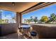 Covered patio with bistro table and seating offering stunning views of the community at 8155 E Roosevelt St # 231, Scottsdale, AZ 85257