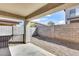 View of the back patio of the house, with concrete and rocks for landscaping at 849 E Impreria St, San Tan Valley, AZ 85140