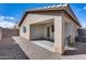 Covered back patio with desert landscaping, creating an outdoor living space at 849 E Impreria St, San Tan Valley, AZ 85140