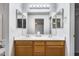 Bathroom featuring a double sink vanity, white walls and bright lighting at 849 E Impreria St, San Tan Valley, AZ 85140