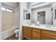 Bathroom featuring a double sink vanity and a shower and tub combination at 849 E Impreria St, San Tan Valley, AZ 85140