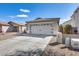 Inviting single-story house with a well-maintained driveway and a two-car garage at 849 E Impreria St, San Tan Valley, AZ 85140