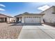 Charming single-story home featuring a two-car garage and low-maintenance desert landscaping at 849 E Impreria St, San Tan Valley, AZ 85140