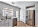 Updated kitchen with stainless steel appliances and a view of the backyard at 849 E Impreria St, San Tan Valley, AZ 85140