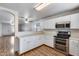 Well-lit kitchen featuring stainless steel appliances and white cabinetry at 849 E Impreria St, San Tan Valley, AZ 85140