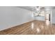 Open-concept living room with wood-look floors adjacent to the kitchen at 849 E Impreria St, San Tan Valley, AZ 85140
