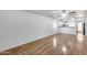 Open living space with wood-look flooring, neutral walls, and ceiling fans for added comfort at 849 E Impreria St, San Tan Valley, AZ 85140