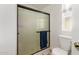 Bathroom featuring glass shower, toilet, and roller shade at 8500 E Southern Ave # 447, Mesa, AZ 85209
